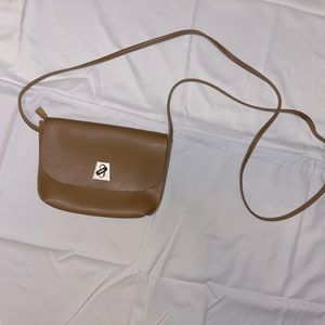 Tan twist lock long strap cross body small bag